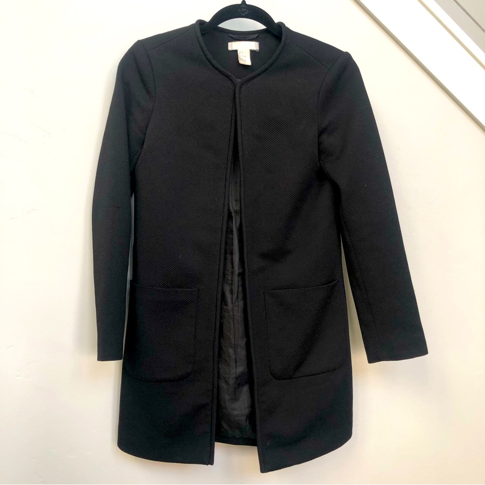 Light coat. Size 4 or small. Good condition.